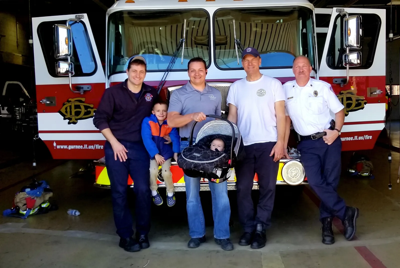 Joe Lapera and family with Grayslake firefighters